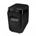 In the photo, there are two Fellowes Medium Office Shredders, the Automax 200M Shredder and the Micro Cut P-5 Ref 4656401. They are both in a sleek black color and have a modern design. The shredders are placed side by side on a desk, with paper being fed into them. The shredded pieces of paper can be seen spilling out into a bin below. The sharp blades of the shredders can be seen in action, quickly cutting through the paper.