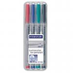 The photograph shows a set of Staedtler OHP markers, specifically the 316 Lumocolor pen with a fine 0.6mm line. They are non-permanent and come in a range of assorted colors in a convenient wallet of 4. The markers are sleek and professional-looking, with clear labels and a comfortable grip for precise writing.