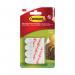 The image shows a pack of 12 small 3M Command adhesive poster strips, designed specifically for hanging pictures securely. Each strip is equipped with the reliable Command adhesive technology, making it easy to use without damaging walls.