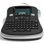 The photograph features the sleek and compact Newell Brands Label Maker, the Dymo LabelManager 210D. The multi-language QWERTY keyboard and D1 label ref provide convenience and versatility in labeling tasks. Its desktop design is practical and efficient for any workspace.
