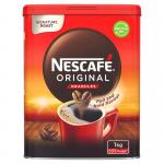 The photo shows a shiny, round metal tin with the label Nescafe Original in bold red letters. Inside, the granules of instant coffee are dark and finely ground, promising a rich and flavorful beverage. The tin stands tall, with a lid that can be easily opened to access the coffee inside.