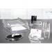 This image displays an organized desk set featuring the ACCO Brands Desk Sets & Tidies Rexel Nimbus Pen Pot. The pen pot is made of clear acrylic and is large in size, providing ample space for storing pens and other writing utensils. The design is sleek and modern, adding a touch of sophistication to any desk space. Other items in this desk set may include paper trays, file organizers, and other tidies to keep the desk clutter-free.