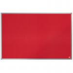 The photo shows an ACCO Brands Noticeboards Nobo Essence Felt Notice Board in the color red. The board measures 900x600mm and is made of high-quality felt material. The surface is smooth and velvety, ideal for pinning notes, memos, and other important papers. The board is bordered by a sleek silver frame, adding a touch of style to any room. The red color adds a bold pop of color to the office or home environment. Overall, this notice board appears functional and visually appealing.