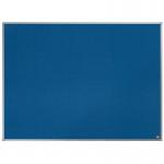 The image shows a blue, rectangular-shaped ACCO Brands Noticeboards Nobo Essence Felt Notice Board measuring 1200x900mm. The surface of the board is covered with a soft, felt material, giving it a tactile and cozy appearance. The edges of the board are neatly bordered with a slim, silver frame, adding a touch of modernity to the overall look. The board is mounted on a wall, and various paper notes and pins can be seen attached to its surface, indicating its use as a message or memo center. The blue color of the board adds a pop of color to any space, making it a functional and stylish addition to any office or home.