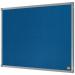 In the photo, there is a blue ACCO Brands Nobo Essence Felt Notice Board measuring 600x450mm. The surface is covered in a soft, felt material and there are silver colored pins holding notes and papers in place. The board is mounted on a white wall and has a sleek, modern design. The edges are smooth and there is a small silver brand logo in the bottom corner. The surrounding area is clean and professional, making this notice board a great addition to any office or workspace.