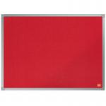 The picture shows a red felt notice board with the brand name Nobo Essence printed on the top left corner. The notice board measures 600x450mm and is displayed against a plain white background. It is mounted on a wall with silver pins or hooks at each corner. The felt surface is smooth and free of any wrinkles or creases, providing a clean and professional aesthetic. The edges are neatly trimmed and the color is a vibrant and eye-catching shade of red. Pins and other accessories can be seen attached to the board, indicating its practical use for displaying information or notices.