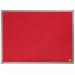 The picture shows a red felt notice board with the brand name Nobo Essence printed on the top left corner. The notice board measures 600x450mm and is displayed against a plain white background. It is mounted on a wall with silver pins or hooks at each corner. The felt surface is smooth and free of any wrinkles or creases, providing a clean and professional aesthetic. The edges are neatly trimmed and the color is a vibrant and eye-catching shade of red. Pins and other accessories can be seen attached to the board, indicating its practical use for displaying information or notices.