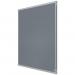 In the photo, there is a grey 900x600mm felt notice board produced by ACCO Brands. The design features the brand name Nobo in the top corner. The felt material gives the board a textured appearance, while the size makes it ideal for displaying important messages and notes. The sleek grey color adds a touch of elegance to the overall look. The board is mounted on a wall, and push pins can be seen holding up various papers and reminders. It is a practical and stylish addition to any office or home space.