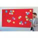 In this photo, we see a sleek and modern Nobo Impression Pro Widescreen Felt Notice Board by ACCO Brands. The vibrant red felt surface measures 710x400mm and is perfect for displaying important messages and memos. The smooth aluminum frame adds a touch of sophistication to this functional and versatile notice board.