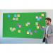 In this photo, we see a vibrant green Nobo Impression Pro Widescreen Felt Notice Board from ACCO Brands. The board measures 710x400mm and is covered in soft, durable felt material. The surface is perfect for pinning important notes and reminders, with ample space for organizing and displaying information. The sleek design of the board adds a touch of style to any space, making it a functional and attractive addition to any office or home.