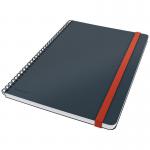 The photo shows a Leitz Cosy Notebook with a soft touch velvet grey cover. The notebook is wirebound and features ruled pages. The ACCO Brands logo can be seen on the cover.