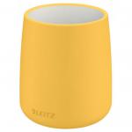 In the photograph, a bright yellow Leitz Cosy Pen Pot from ACCO Brands Desk Sets & Tidies collection is featured. The pot has a sleek and modern design, with a smooth and glossy finish. It is filled with various types of pens and pencils, organized neatly and easily accessible. The warm yellow color adds a pop of brightness and warmth to the desk set, making it a stylish and practical addition to any workspace.