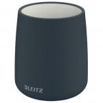 The image shows an elegant pen pot in a deep, rich velvet grey color. The pot is from ACCO Brands Desk Sets & Tidies collection, specifically the Leitz Cosy line. The soft fabric and sleek design give off a cozy and stylish vibe, making it a perfect addition to any desk. The pot appears to be sturdy and well-crafted, with enough space to hold multiple pens and pencils. Overall, this pen pot exudes sophistication and functionality.