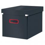 The photograph features the cozy cube design of the Leitz Click & Store Storage Box in a luxurious velvet grey color. The large size of the box is visible, along with the sturdy and sleek Leitz brand name. The storage box is shown in use or displayed on a shelf, highlighting its functionality and stylish design.