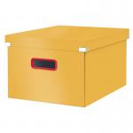 This photo features a vibrant warm yellow medium storage box from Leitzs Click & Store Cosy collection. The box is designed with durable materials and a modern click system, perfect for organizing small items in any home or office space.