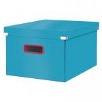 This photograph features a stack of Leitz Click & Store Cosy Medium Storage Boxes in a calming shade of blue. The boxes are neatly organized with their click-in lids, making them ideal for storing and organizing various items. The boxes have a sleek and modern design with the Leitz logo visible on the front.