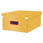 This photo features a stack of Leitz Click & Store Cosy Large Storage Boxes in warm yellow. The boxes have a sleek design with a convenient click closure and are perfect for organizing various items in your home or office.