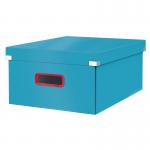 This photograph captures a bright blue Leitz Click & Store Cosy Large Storage Box nestled among other Leitz Storage Boxes. The box features a textured design and a convenient click-lock feature for secure storage.