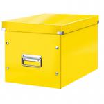 The picture shows a bright yellow storage box from Leitz WOW collection. It is a large, cube-shaped box with the Click & Store feature, allowing for easy assembly and sturdy storage. The Leitz logo is visible on the front.