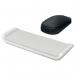 This photo features an ACCO Brands Wrist Rests Leitz Adjustable Mouse Wrist Rest in the Ergo Cosy range. The wrist rest is made of light grey foam cushioning and is designed for both left and right handed users. The wrist support pad can be adjusted to provide comfortable support for any size of mouse. In the photo, the wrist rest is placed on a desktop, creating a cozy and ergonomic workspace.