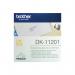 The photograph features a pack of 400 Brother Black on White Paper Standard Address Labels by P-Touch, labeled as DK11201 BA62988. These paper labels are neatly stacked in a transparent plastic packaging and are designed to be compatible with Brother printers. The labels have a clean white background and bold black text, making them easy to read. Each label also has a peel-off backing for quick and effortless application.