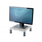 The image is a pair of Fellowes Monitor Stands & Dust Covers. The stands are in platinum color and have a standard monitor riser design. One stand is slightly taller than the other. The dust covers are placed on top of the stands.