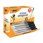 A picture of Bic Ballpoint Pens Bic Cristal Ballpoint Pen Medium Black Pack of 100 shows a group of 100 black ballpoint pens neatly organized in a pack. The pens have the Bic logo printed near the clicker and a medium-sized, silver-colored ballpoint tip. The pens have a sleek, simple design and are made of durable plastic. The pack has a clear plastic wrap around it, allowing the pens to be visible and easily accessible.