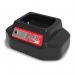 In the photo, there is a cluster of Numatic vacuum cleaners, specifically the NU1334 model, along with a sleek NX battery charger. The vacuum cleaners have a compact and sturdy design, with bright red and black colors. The charger is slim and modern-looking, adding to the overall clean and professional aesthetic of the photo.