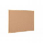 This photograph showcases a stylish Bi-Office Corkboard with a 120x90cm cork surface, framed in Oak MDF. The design exudes professionalism and elegance, making it a perfect addition to any executive office or workspace. Its natural cork surface is ideal for pinning notices, memos, and other important documents.