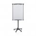 The photograph features a group of Bi-Silque Flipchart Easels & Pads Bi-Office Mobile Magnetic Flipchart Easels, with a smooth white surface measuring at 700x1000mm. The easels have sturdy frames and are mounted on mobile stands, making them easily transportable. The magnetic surface can hold various types of papers, and the easels are designed for a versatile and functional use. The clean and sleek design is ideal for use in offices, classrooms, or meetings.