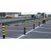 In the photo, two Beaverswood Supply Ltd safety barriers are shown, one with a black post and the other with yellow reflectors. The flexi delineator posts measure H.1000 x W.80 x D.80, creating a sturdy yet visible safety barrier.