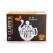The photograph shows a pack of Clipper Fairtrade Everyday Tea Bags, containing 440 individual tea bags. The packaging is simple and elegant, with a red and white color scheme and the Clipper logo prominently displayed. The tea bags themselves are pyramid-shaped and made of biodegradable materials. A cup of hot tea can be seen in the background, steam rising from the surface. Overall, the photo is inviting and represents a high-quality, ethically-sourced tea product.