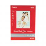 In this photograph, we see a pack of 100 Canon A4 glossy photo paper, weighing 200gsm. The paper appears smooth and shiny, with a pack design featuring the Canon logo and product information. The pack is large and rectangular, with a blue and white color scheme.