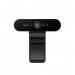 The photograph shows the Logitech BRIO 4K Ultra HD webcam with a sleek, modern design. The camera lens is prominent in the center, surrounded by a metallic border. The base is sturdy and adjustable, allowing for versatile placement options. The image quality is clear and vibrant, capturing every detail with its 4K resolution.