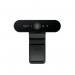 The photo depicts a sleek, black Logitech BRIO 4K Stream Edition Webcam with the brand name clearly displayed. The 4K resolution and Stream edition label are also visible, showing off its advanced capabilities. The camera sits on a stand with its adjustable lens pointed towards the viewer.