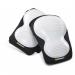 The photograph features a pair of Beeswift trousers in a crisp white and black colorway with ridged knee pads. The knee pads are made of poly material and provide added protection for the wearer. The trousers appear durable and functional, perfect for a variety of tasks.