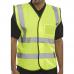 The photograph shows a collection of bright yellow Beeswift high visibility vests, specifically the Hi Viz Id Vest En20471 model. The vests are neatly stacked on a table, with their reflective strips clearly visible. The Beeswift logo can be seen on the front of the vests.
