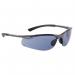 In the image, a pair of Bolle glasses and goggles is featured. The frames are sleek and black, with the Bolle logo on the side. The lenses are a platinum smoke color, giving them a modern and stylish look. These glasses are designed with safety in mind, making them perfect for any task or activity.