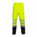The picture shows a pair of Deltic high visibility trousers in a bright saturn yellow color. The trousers have a two-tone design and are made by Beeswift. They are labeled as size 5XL and are meant to be worn over other clothing.