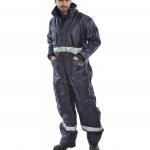 In the photograph, a worker is wearing a navy blue Beeswift coldstar freezer coverall, with the Beeswift logo on the chest. The overalls and coverall provide full body coverage and protection, with a secure and comfortable fit. The dark blue color adds a professional and functional touch to the garment.