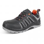 The image shows a pair of black and orange Beeswift shoes, specifically the Beeswift Trainer S3 Non Metallic style, in size 06. The shoes have a sleek design with a lace-up closure, and the upper material appears to be a combination of leather and mesh. The sole is rugged and durable, providing excellent traction.