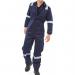 The photograph features a navy blue Beeswift overalls and coverall set, made with flame-retardant material and anti-static properties. The boilersuit has a sleek, professional design and is labeled with the Beeswift brand.
