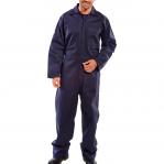 The photograph shows a durable navy blue overalls and coverall set, made by Beeswift. Both pieces are fire retardant and feature the iconic Beeswift logo. The overalls and coverall have a comfortable fit and are suitable for various job sites and industries.