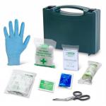 The image shows a blue box from Click Medical containing first aid supplies, with the label BS8599-1:2019 BSI Personal Issue Pack on the box. The box is open and some items, such as bandages, gauze, and scissors, are visible inside. The box also has the product name CM0009 printed on it.