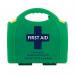 The photo showcases a compact workplace first aid kit, featuring a glow in the dark design and labeled with the standard BS8599-1. It includes essential items for medical emergencies, easily accessible with a simple click mechanism.