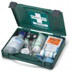 The image shows a compact, red and white medical travel first aid kit by Click Medical. It is certified to BS8599-1 standards and labeled as CM0130. The kit contains various medical supplies and is suitable for travel purposes.