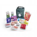 The photograph shows a compact travel first aid kit with the brand name Click Medical printed on the front. The kit includes insect repellent and various medical supplies, all neatly organized in individual compartments. The kit has a sturdy handle for easy carrying and a zipper closure to keep items secure. The bright red color makes it easily identifiable in case of emergency. Overall, the kit appears to be well-stocked and convenient for any travel situation.
