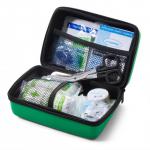 The picture shows a compact green travel first aid kit from Click Medical, designed to meet BS8599-1 standards. It comes in a small Feva case and includes essential supplies for medical emergencies on the go.