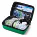 The picture shows a compact green travel first aid kit from Click Medical, designed to meet BS8599-1 standards. It comes in a small Feva case and includes essential supplies for medical emergencies on the go.