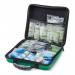 The photo shows a large, red Feva case with the words Click Medical First Aid on it. Inside, there is a medium-sized first aid kit with various medical supplies and equipment neatly organized. The kit is labeled with the BS8599-1 standard.